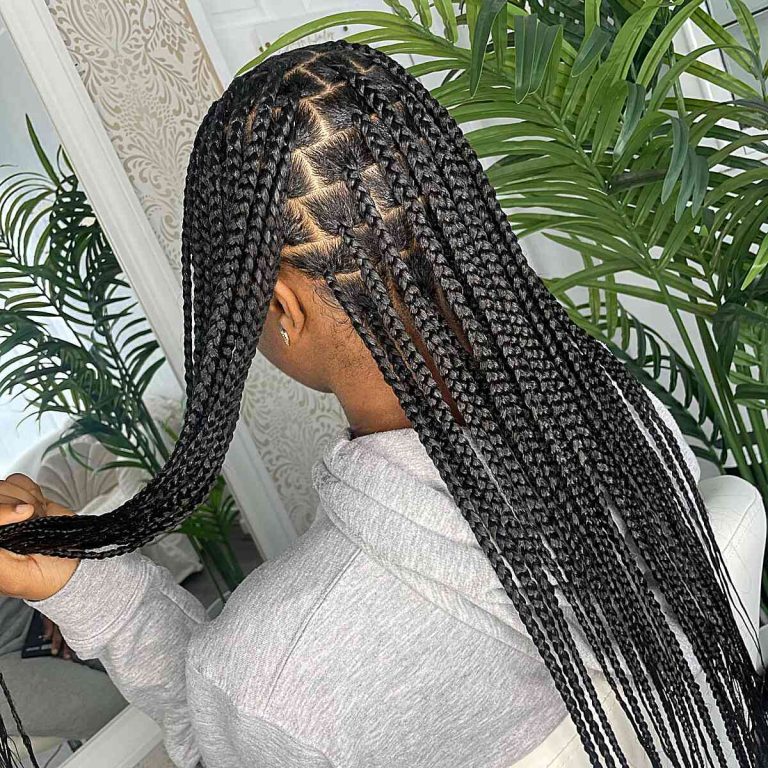 Knotless braids with sleek baby hairs at Tracy's Beautique